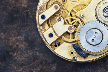 Fototapeta na wymiar Vintage clock close-up, time mechanism with metal gears