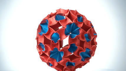 Colorful origami ball close up. Blue and red spherical shape origami figure. Meteorite origami...