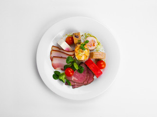 Smoked pork chops, Smoked Pork Breast, Eggplant with peppers and almond flakes, Chicken meat bowls on the tray, Cheeses with nuts and grapes, Chicken gallatin with mushrooms, Chicken roll and sausage 