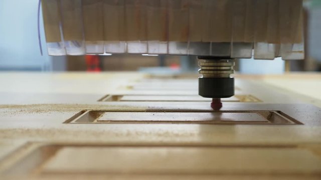 Wood milling on the machine with CNC closeup