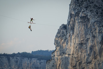 two people surfing on a line during a base jump session, Auvergne-Rhône-Alpes,...