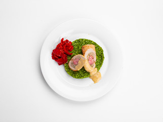 Pork chops, stuffed with pheasants, sausages, spinach with spinach, courgettes, veloute sauce, wild mushrooms, peppercorns. 