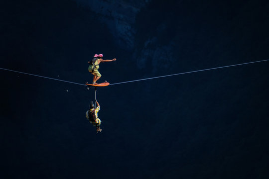 two people surfing on a line during a base jump session, Auvergne-Rh&ocirc;ne-Alpes, Saint-Julien-en-Vercors, France