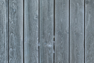 A fence of smooth gray boards. Background with texture of old wood. Photo for layouts.