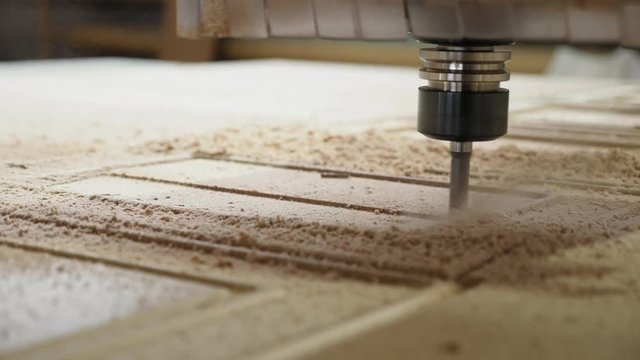 Wood milling on the machine with CNC closeup