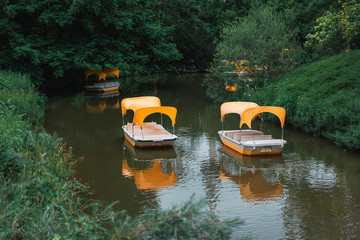 yellow boats floating in the river