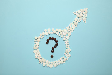 Obraz premium Pills in symbol of male. Male sexual dysfunction concept. Age problem of potence.