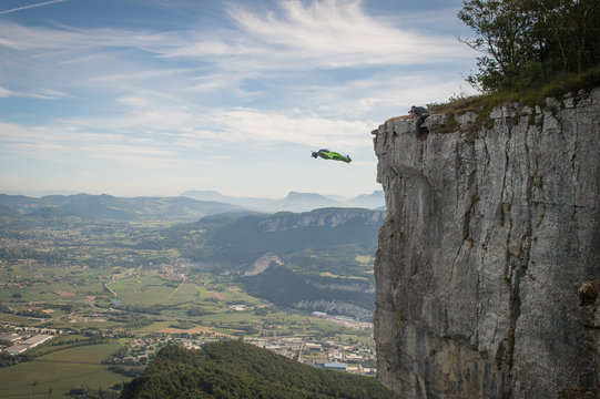 a wingsuit jumper jumping from a cliff in France, Auvergne-Rh&ocirc;ne-Alpes, Choranche, France