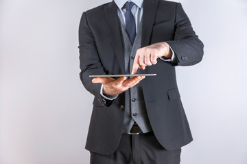 Businessman using tablet computer in office