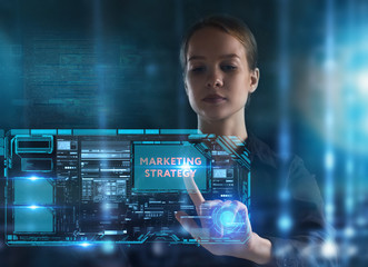 The concept of business, technology, the Internet and the network. A young entrepreneur working on a virtual screen of the future and sees the inscription: marketing strategy