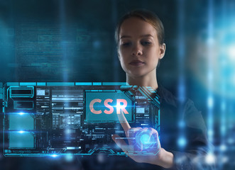 The concept of business, technology, the Internet and the network. A young entrepreneur working on a virtual screen of the future and sees the inscription: CSR