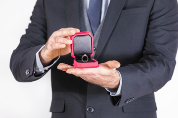Man holding a box with wedding rings