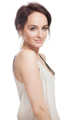 Fototapeta na wymiar Beautiful young woman in beige nightgown on white