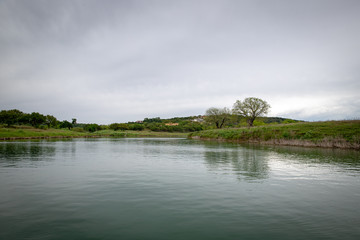 Scenic view across lake on overcast day
