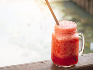 Watermelon juice spun in a dozen glasses, with a pleasant red color, healthy fruit juice concept.