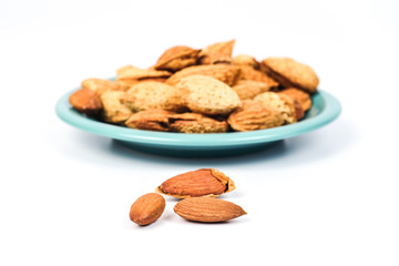 Dry Almonds nuts with shell on white background ,health food.