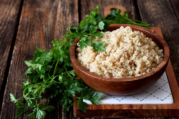 Cooked quinoa in a wooden bowl