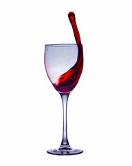 a beautiful splash of wine in a glass on a high stem on a white background