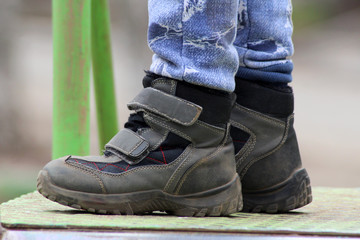 Demi-season leather shoes on children's feet