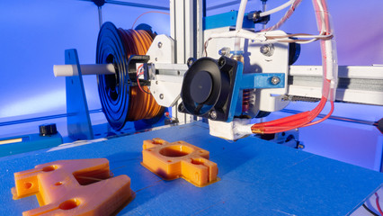 3d printer and orange prototype