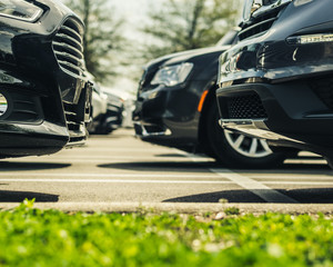 The Fronts of Cars in a Parking Lot