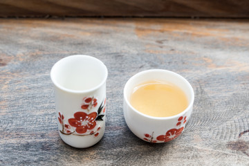 Obraz na płótnie Canvas Oolong tea in the traditional Chinese style cup.