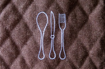 brown mat for kitchen forks and spoons