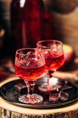 Homemade red currant nalivka and chocolate