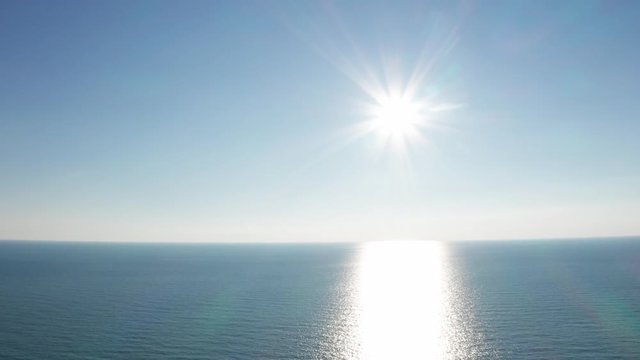 Aerial drone. Sunny day over the sea. Clear horizon. The black sea Sochi. Sea water. Peace, tranquility, beauty, rest.