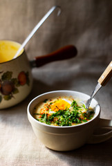 Traditional homemade polish soup Zurek - easter soup with eggs and white sausage in a rustic ceramic bowl. West Slavic cuisine. Close-up