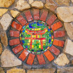 Mosaic symbol of Shinto on wall.