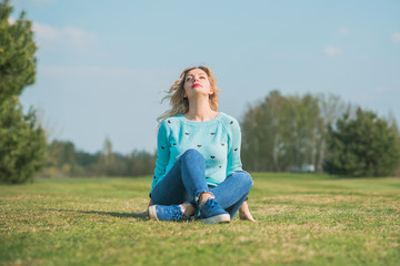 Fototapeta premium Freedom concept. Woman rest at nature field at sunset 