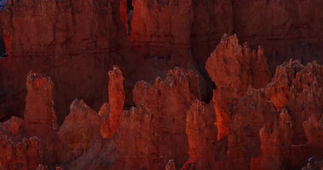 Aerial shot of red rock formations on desertic landscape in 4K