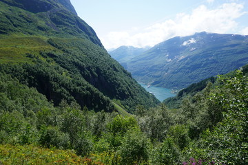 Geiranger fjord with blue sky and with cruise liners in Norway