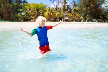 Kids playing on beach. Children play at sea.