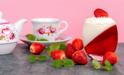 Panna Cotta with strawberries on pink background