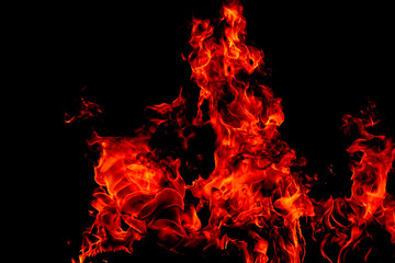 Fire flames on Abstract art black background, Burning red hot sparks rise, Fiery orange glowing flying particles