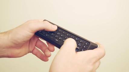 Man Types on TV Remote Control Keyboard 4K