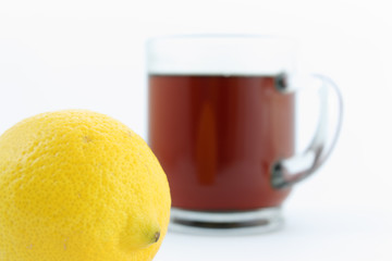 cup of tea with lemon on white background