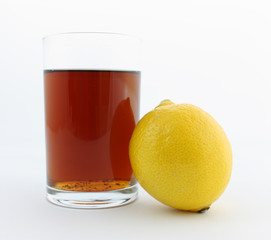 glass of tea and lemon isolated on white