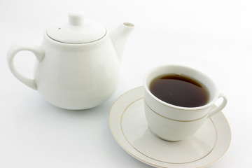 cup of tea and teapot with cup of tea