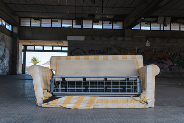 Broken sofa inside abandoned shopping center on Tenerife, Canary islands, Spain - Image