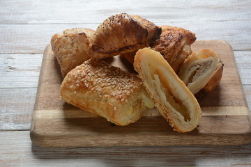 Vegetarian samosas pastries filled with potato, mushrooms, tuna. Middle Eastern food- samsa Bourekas delicious Middle Eastern hand pies. Baked, stuffed pastries filled with potato, mushrooms, tuna.
