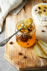 candied fruit jelly. pear marmalade with coffee beans. Jar of pear jam