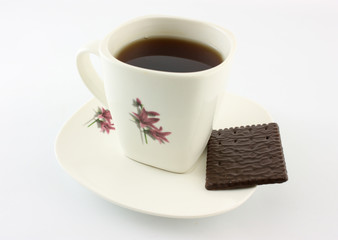 cup of coffee and cookies on white background