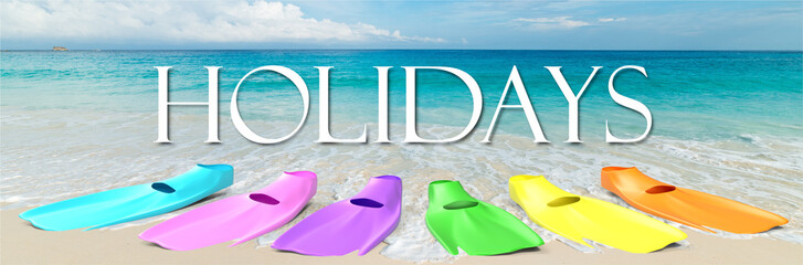 Obraz premium romantic tropical beach and ocean with multicolored diving fins in the summer sun