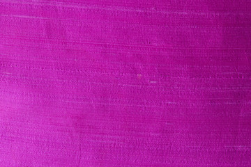 Close up of a woolen fabric of violet color. Abstract canvas background, empty template.