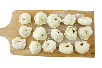 dumplings on cutting board