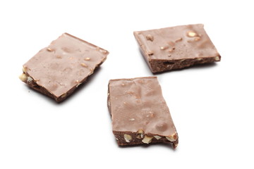 Chocolate bars with hazelnuts isolated on white background
