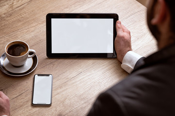 Business man holding blank tablet PC.